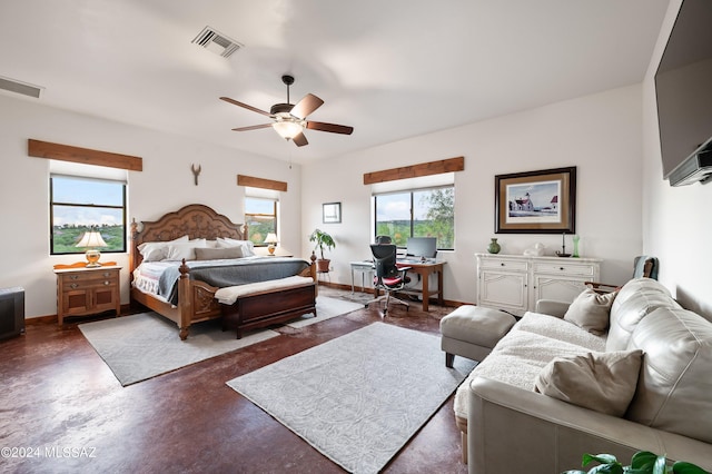 bedroom featuring finished concrete flooring, baseboards, and visible vents