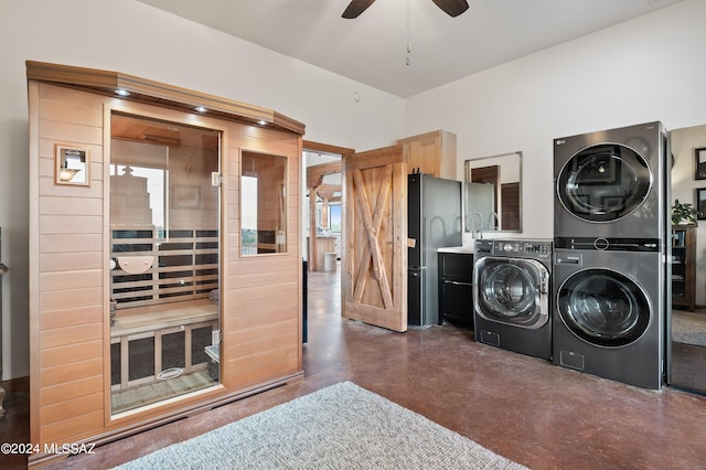 washroom featuring laundry area, ceiling fan, a sauna, and stacked washing maching and dryer