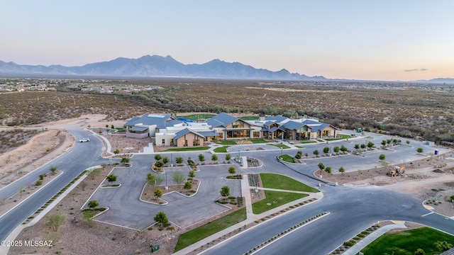 birds eye view of property with a mountain view