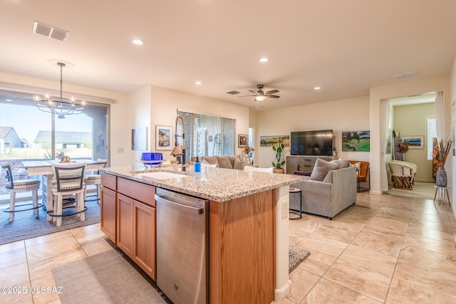 kitchen with light stone counters, recessed lighting, visible vents, an island with sink, and dishwasher