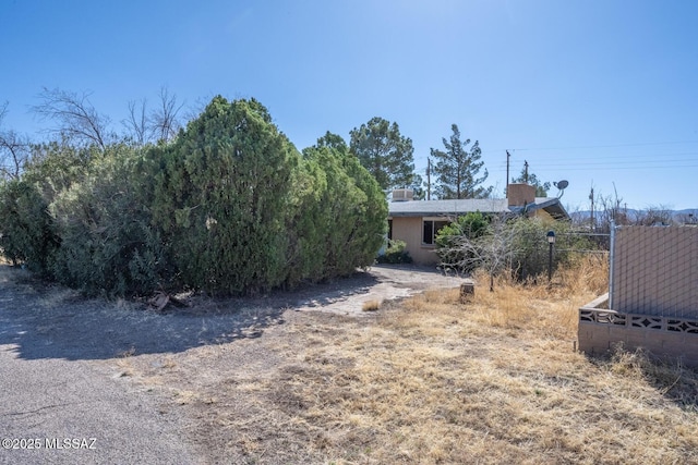 view of front of home with fence