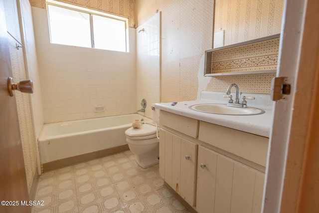 bathroom with bathtub / shower combination, wallpapered walls, toilet, vanity, and tile patterned floors