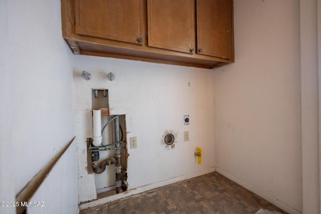 laundry area with cabinet space, baseboards, hookup for a gas dryer, and hookup for an electric dryer