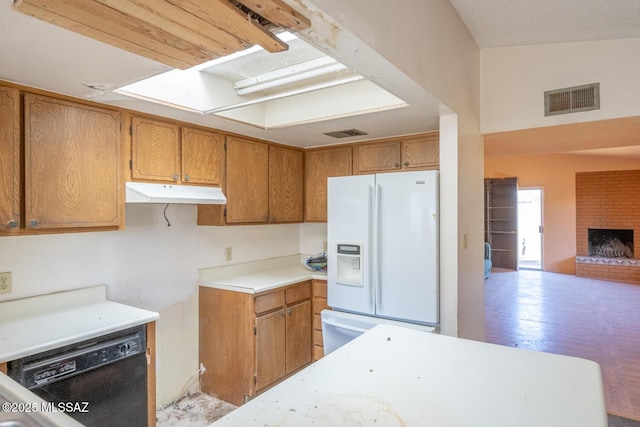 kitchen featuring white fridge with ice dispenser, black dishwasher, visible vents, and under cabinet range hood