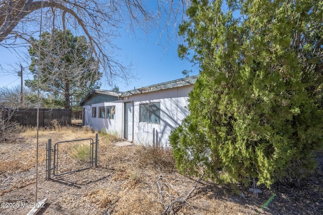 exterior space featuring a gate and fence