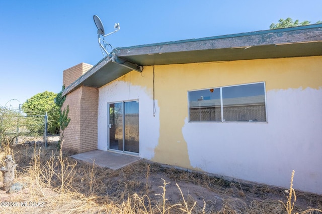 view of property exterior with stucco siding