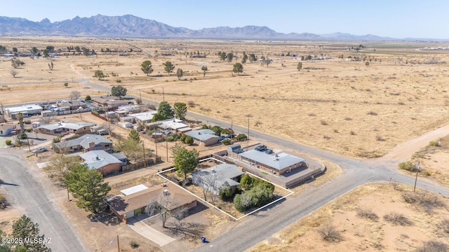 aerial view featuring view of desert, a rural view, and a mountain view