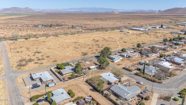 birds eye view of property with a mountain view, a desert view, and a rural view