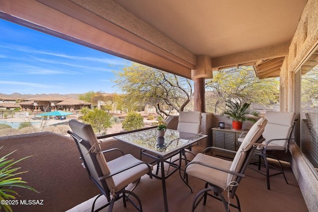 view of patio featuring a balcony