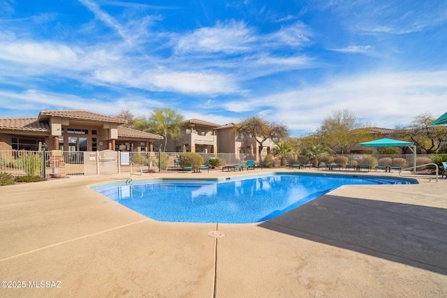 pool featuring a patio and fence