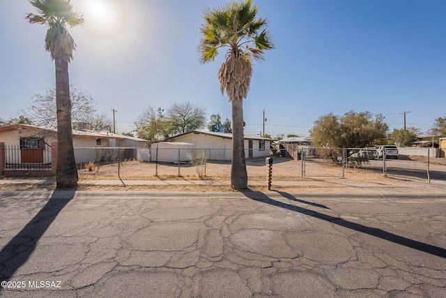 manufactured / mobile home featuring a fenced front yard and a gate