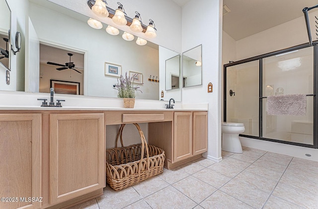 bathroom with tile patterned floors, a shower stall, toilet, and double vanity