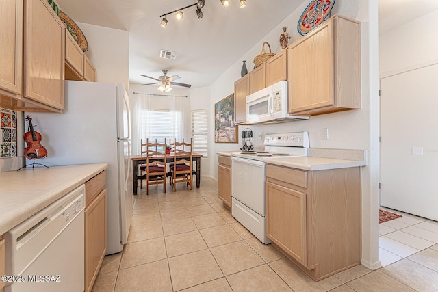 kitchen featuring white appliances, light tile patterned floors, light brown cabinets, visible vents, and light countertops