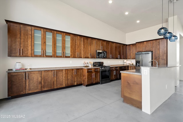 kitchen featuring finished concrete flooring, recessed lighting, stainless steel appliances, glass insert cabinets, and a towering ceiling