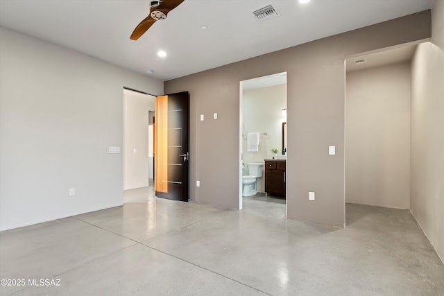 unfurnished bedroom featuring ceiling fan, finished concrete flooring, visible vents, and connected bathroom