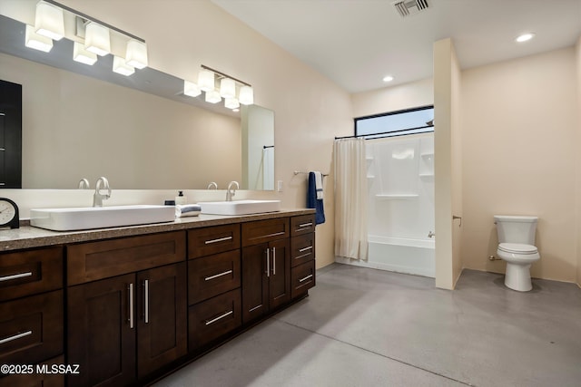 bathroom featuring visible vents, toilet, finished concrete flooring, and a sink