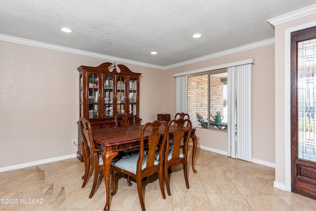 dining room with baseboards, a textured ceiling, and crown molding