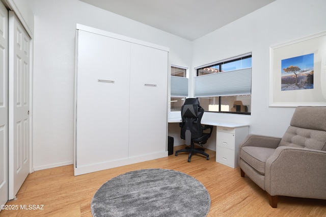 home office featuring light wood-style floors