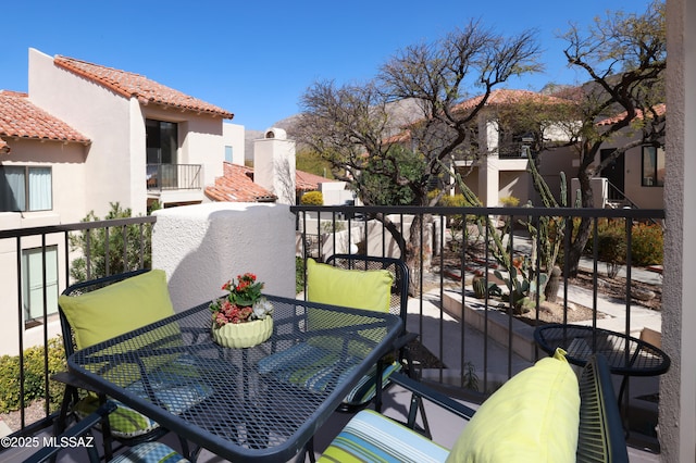 balcony featuring outdoor dining space