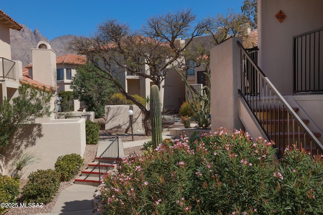 view of yard featuring a mountain view and stairs