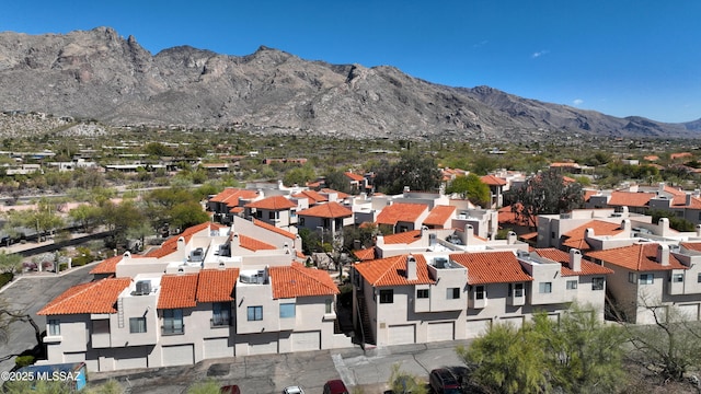 birds eye view of property with a residential view and a mountain view