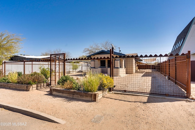 view of front of home featuring a gate and fence