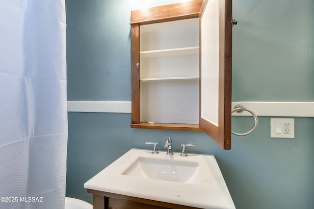 bathroom with toilet and vanity