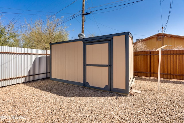 view of shed featuring a fenced backyard