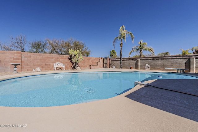 view of pool featuring a fenced in pool and a fenced backyard