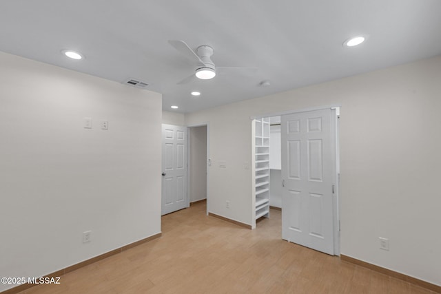 unfurnished room featuring recessed lighting, a ceiling fan, baseboards, visible vents, and light wood-style floors