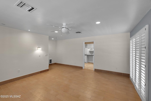 unfurnished room featuring ceiling fan, light wood finished floors, visible vents, and recessed lighting