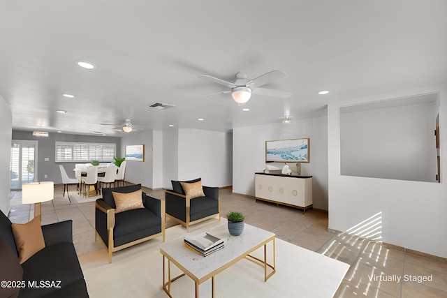 living area with tile patterned flooring, visible vents, a ceiling fan, and recessed lighting