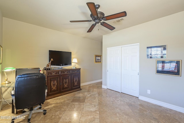 office space with baseboards, visible vents, and ceiling fan