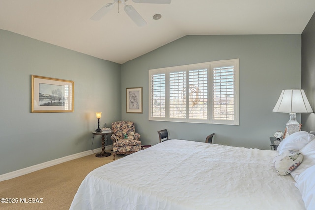 carpeted bedroom featuring vaulted ceiling, baseboards, and ceiling fan