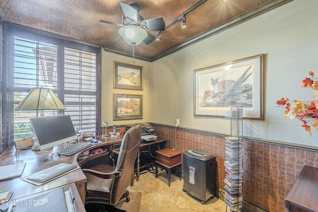 home office featuring a wainscoted wall, ceiling fan, ornamental molding, and track lighting