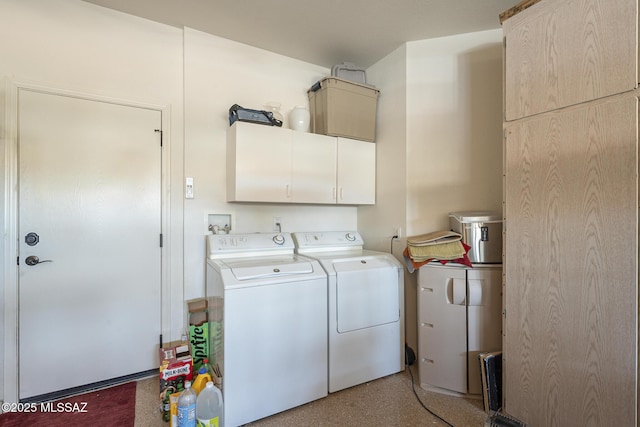 laundry area featuring cabinet space and separate washer and dryer