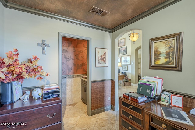 office with arched walkways, a wainscoted wall, visible vents, ornamental molding, and light tile patterned flooring