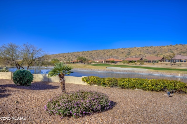 view of water feature with fence