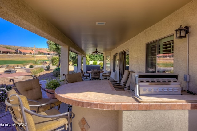 view of patio / terrace featuring visible vents and ceiling fan