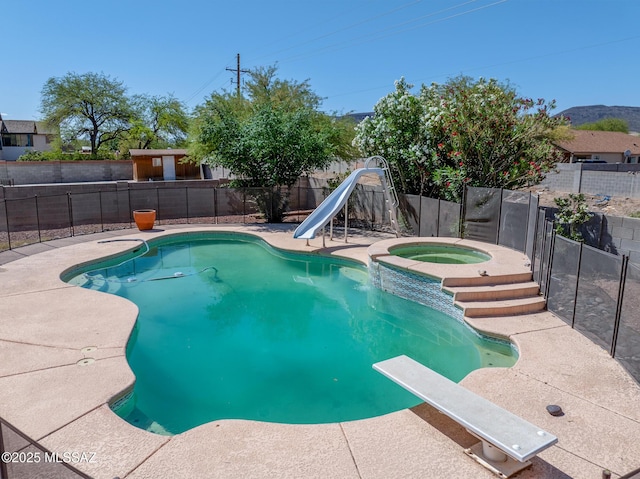 3381 W Calle De La Bajada, Tucson, AZ 85746 - view of swimming pool featuring a water slide, an in-ground hot tub, a fenced backyard, and a diving board