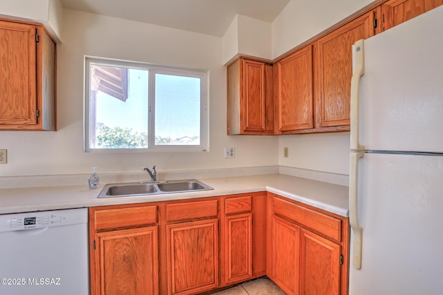 3381 W Calle De La Bajada, Tucson, AZ 85746 - kitchen with white appliances, a sink, light countertops, and brown cabinets