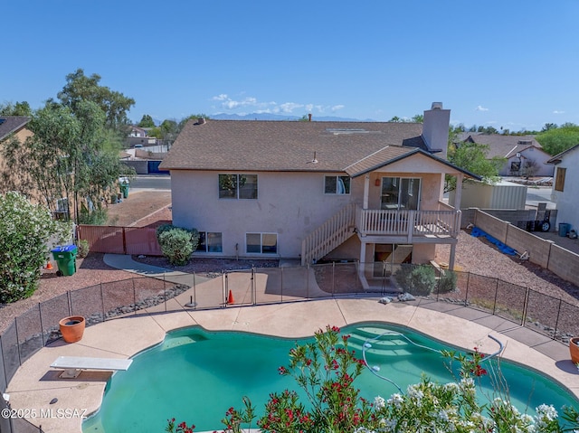 3381 W Calle De La Bajada, Tucson, AZ 85746 - view of swimming pool featuring a fenced backyard, a patio area, stairs, and a wooden deck