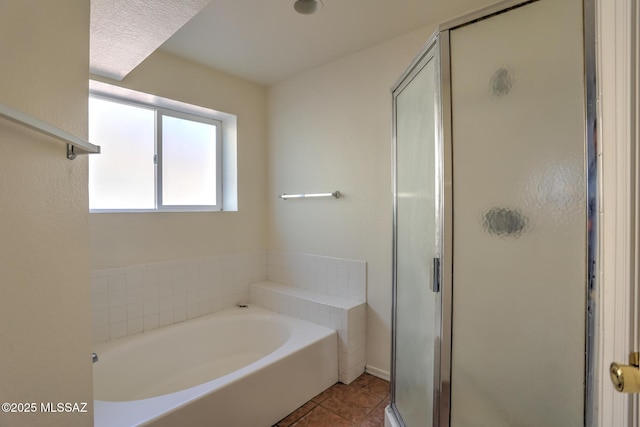 3381 W Calle De La Bajada, Tucson, AZ 85746 - bathroom featuring a bath, a stall shower, and tile patterned flooring