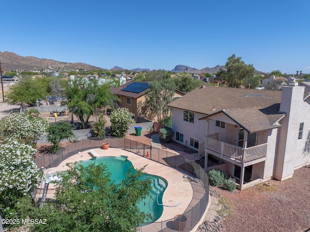 3381 W Calle De La Bajada, Tucson, AZ 85746 - view of swimming pool featuring a fenced backyard, a residential view, and a mountain view