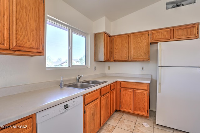 3381 W Calle De La Bajada, Tucson, AZ 85746 - kitchen featuring white appliances, a sink, light countertops, and brown cabinetry