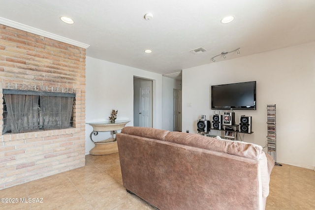 living room with recessed lighting, visible vents, a fireplace, and light tile patterned floors