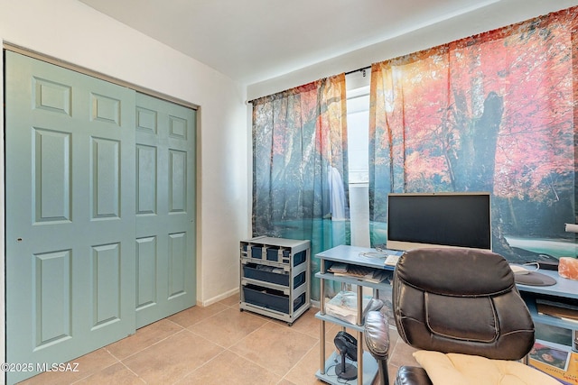 office space featuring light tile patterned floors and baseboards