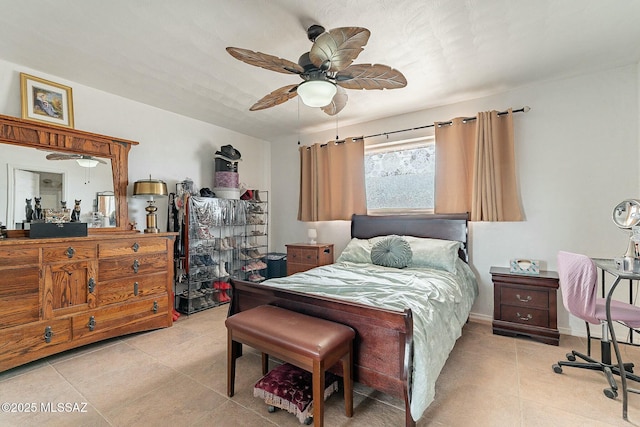 bedroom featuring ceiling fan, baseboards, and light tile patterned floors