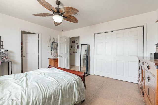 bedroom with a closet, ceiling fan, and light tile patterned floors