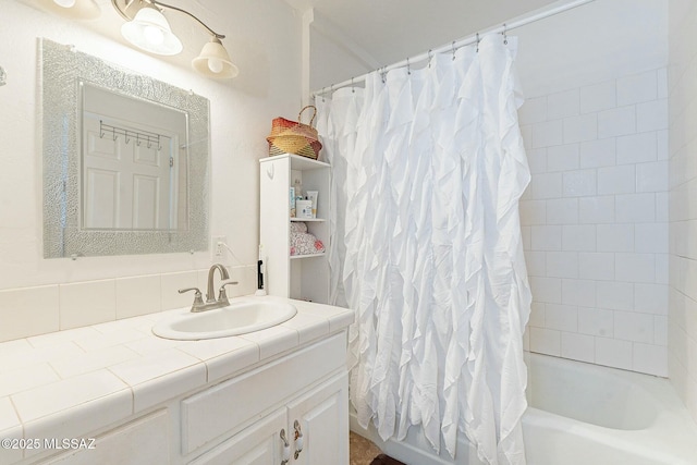 full bathroom featuring vanity and shower / bathtub combination with curtain